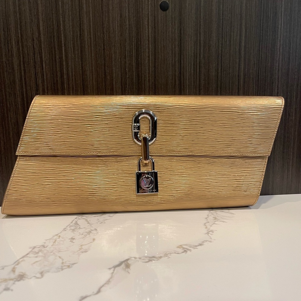 Louis Vuitton LV Blade Clutch gold